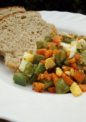 A picture of Nopal cactus salad with boiled egg..and whole wheat bread.