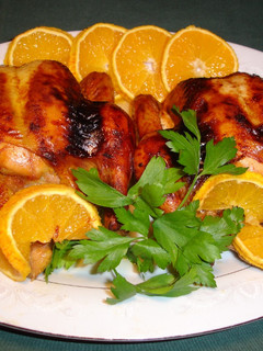 Una foto de Pollitos asados con salsa naranja soja