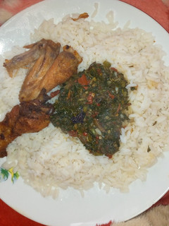 A picture of White rice with vegetable soup nd fried chicken.