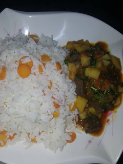 A picture of White rice and liver sauce.