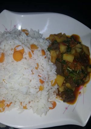 A picture of White rice and liver sauce.