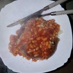 A picture of Jacket potato with beans.
