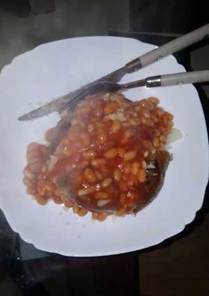 A picture of Jacket potato with beans.