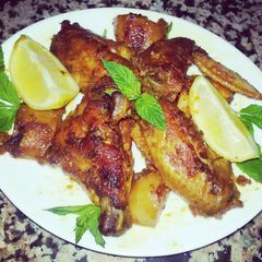 A picture of Oven Grilled Chicken Wings With Potato In Awesome Sauce.