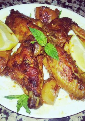 A picture of Oven Grilled Chicken Wings With Potato In Awesome Sauce.