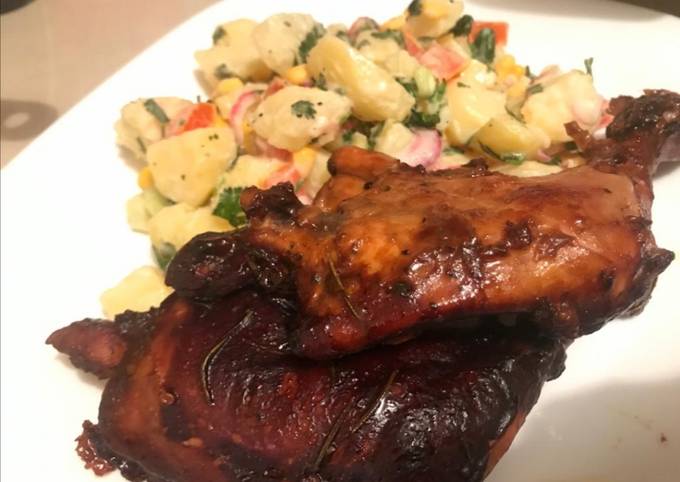 Baked chicken in BBQ sauce and potato salad