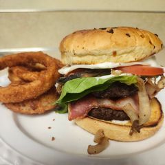A picture of Brad's Double Bacon, Onion, Mushroom, Bacon Bleu Cheese Wagyu Burger.