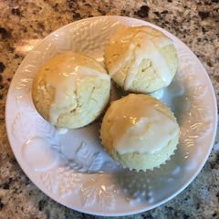 A picture of Orange Muffins with an Orange Drizzle Glaze.