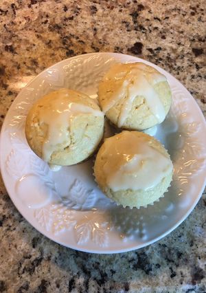 A picture of Orange Muffins with an Orange Drizzle Glaze.