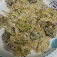 A picture of Egg Noodles with Meatballs in Alfredo Sauce.