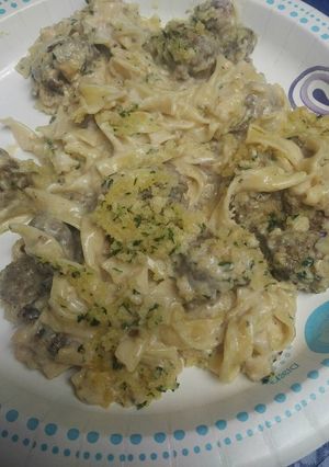 A picture of Egg Noodles with Meatballs in Alfredo Sauce.