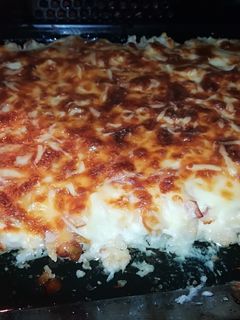 Una foto de Coliflor gratinada con bechamel, bacon y champiñones