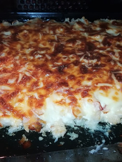 Una foto de Coliflor gratinada con bechamel, bacon y champiñones