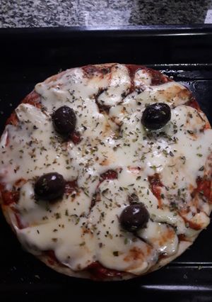 Una foto de Prepizza con jamón queso y orégano.