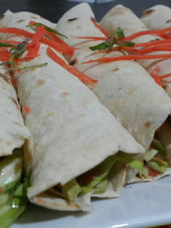 A picture of Chicken Shawarma with Homemade Saj Bread.