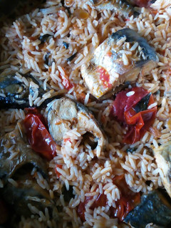 A picture of Jollof rice with fresh Titus fish.