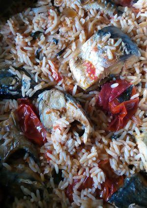 A picture of Jollof rice with fresh Titus fish.