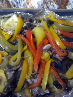 A picture of Steamed fish with veggies.