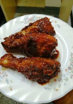 A picture of Honey and ketchup glanced chicken drumsticks.