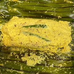 A picture of Hilsa paturi (fish steamed in banana leaf).