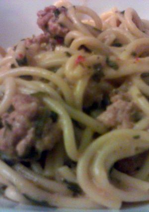 A picture of Pasta, italian sausage and spinach one dish meal.