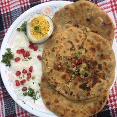 A picture of Coconut & plain sev paratha.