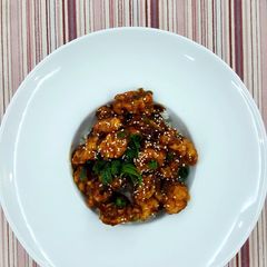 A picture of General Tso Chicken with Rice.