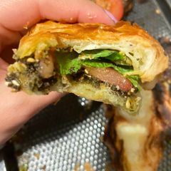 A picture of Zaatar and cheese croissant.