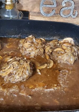 A picture of Hamburger Steaks with Mushroom and Onion Gravy.