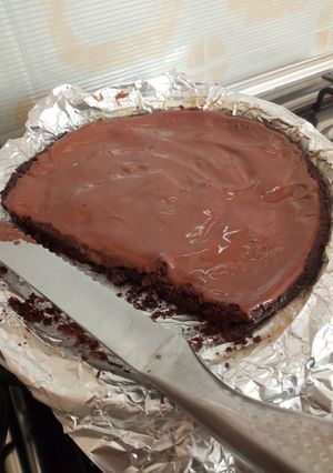 A picture of Brownies with ganache.