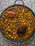 Paella de cangrejo azul y potón