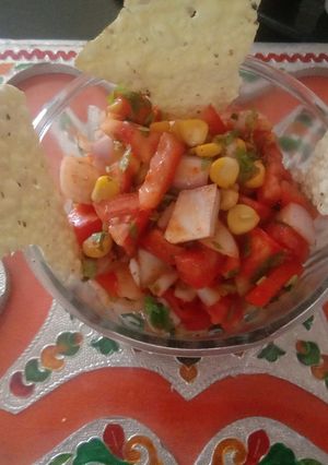 A picture of Corn salad with roasted papad.