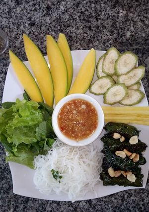 A picture of Grilled Beef Wrapped in Betel Leaves.