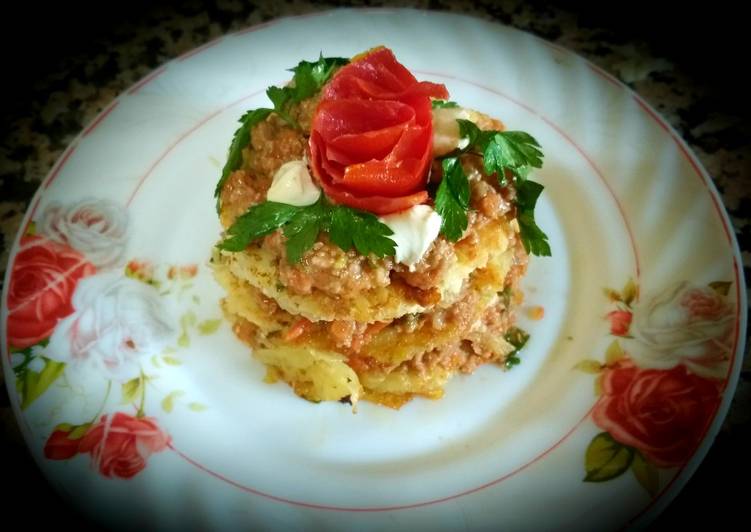 Sandwich with grated potato and chopped meat,cheese,tomato