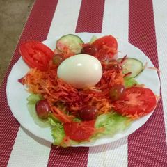 A picture of Boiled egg and vegetables.