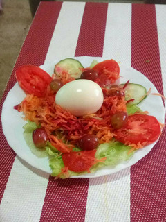 A picture of Boiled egg and vegetables.