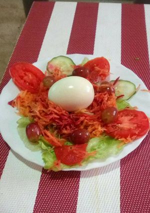 A picture of Boiled egg and vegetables.