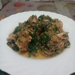 Chicken stew in spinach A picture of Chicken stew in spinach.