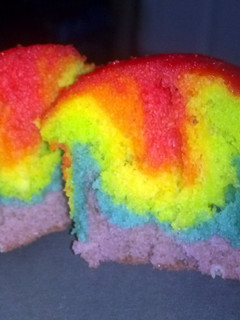 A picture of rainbow cupcakes.