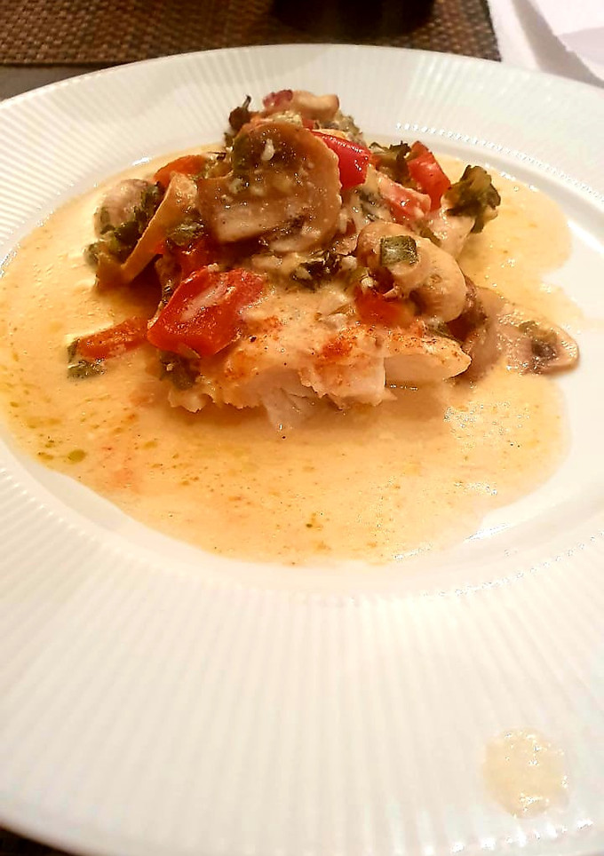 Una foto de Chernia al roquefort y champiñones