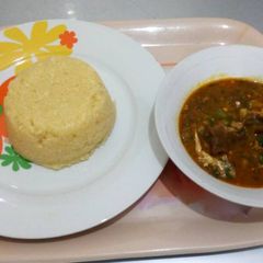 Okro soup with yellow garri A picture of Okro soup with yellow garri.