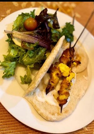 A picture of Yellow chicken skewers.