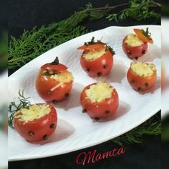 A picture of Baked-cheese stuffed tomatoes.