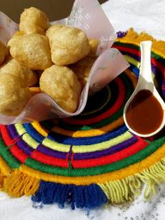 A picture of Puffpuff and caramel sauce.