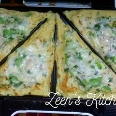 A picture of Cheese Loaded Veg and Egg Toaster Sandwiches.