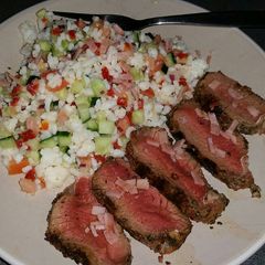 A picture of Grilled greek beef w' cold rice salad & bacon crumble.