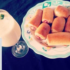 A picture of Sausage rolls with Banana Milkshake.