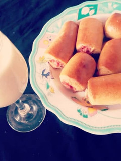 A picture of Sausage rolls with Banana Milkshake.