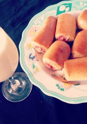A picture of Sausage rolls with Banana Milkshake.
