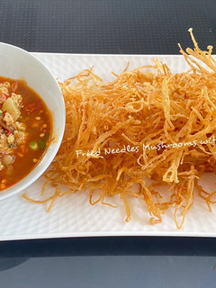 A picture of Fried Needle Mushrooms with Spicy Sauce.